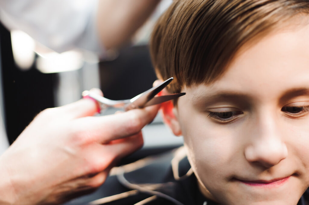 Young boy getting hair cut. Picture day tips.