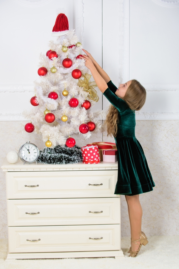 If you're looking for fun and easy holiday decor for kids rooms, why not put a small Christmas tree in their room. They will love it! 